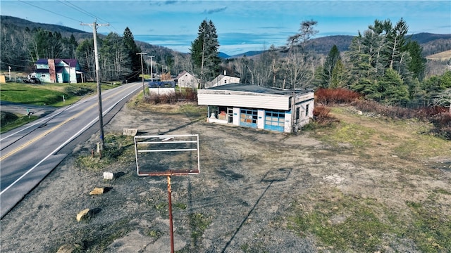 birds eye view of property with a mountain view