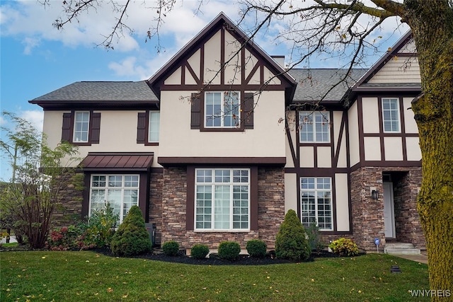 tudor-style house with a front lawn