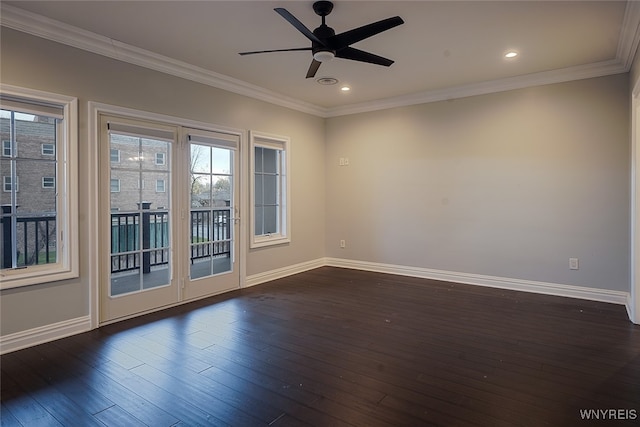 empty room with dark hardwood / wood-style flooring, ceiling fan, and crown molding