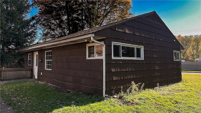 view of side of property featuring a yard