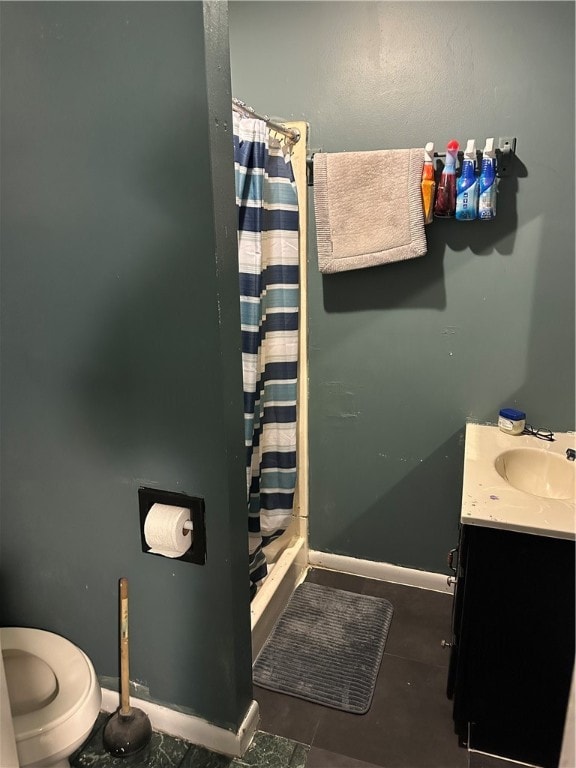 bathroom with curtained shower, tile patterned flooring, vanity, and toilet