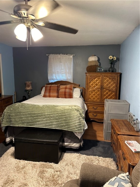 bedroom with ceiling fan and carpet floors