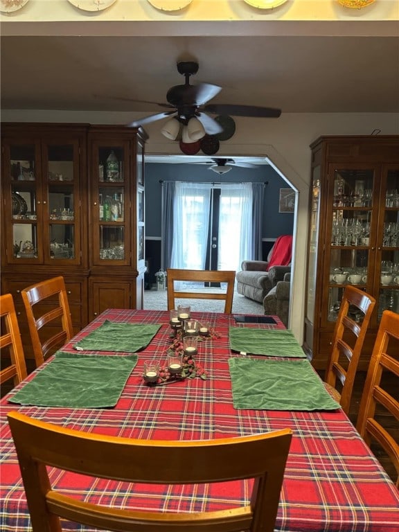 dining room with ceiling fan and french doors