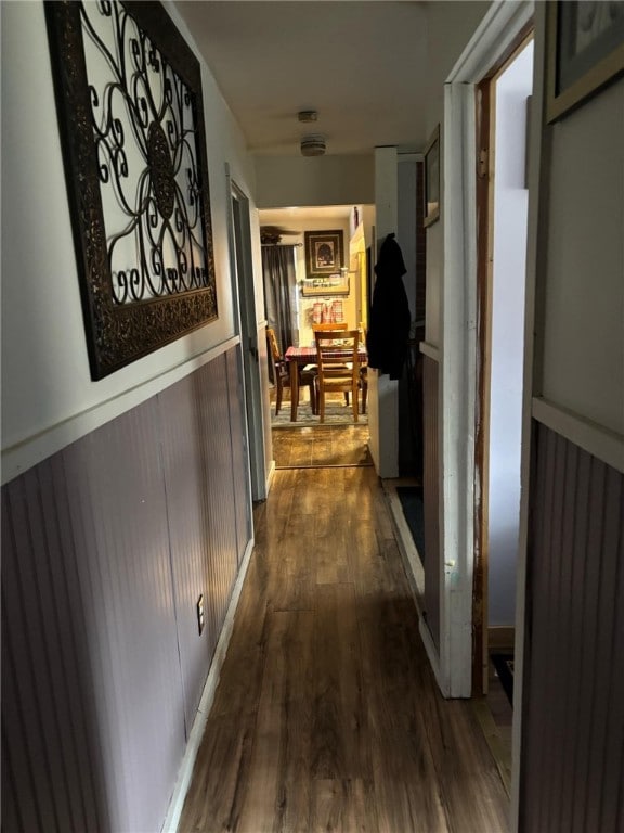 hallway featuring dark hardwood / wood-style flooring