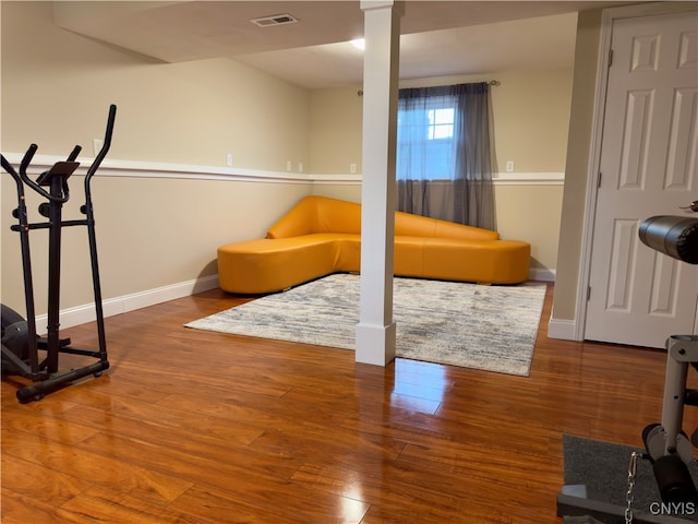 exercise room featuring wood-type flooring