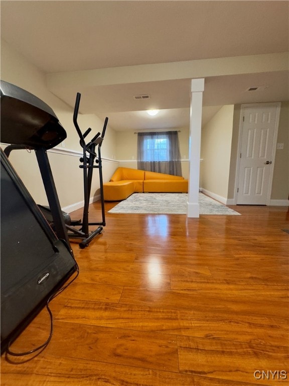 exercise area with hardwood / wood-style flooring