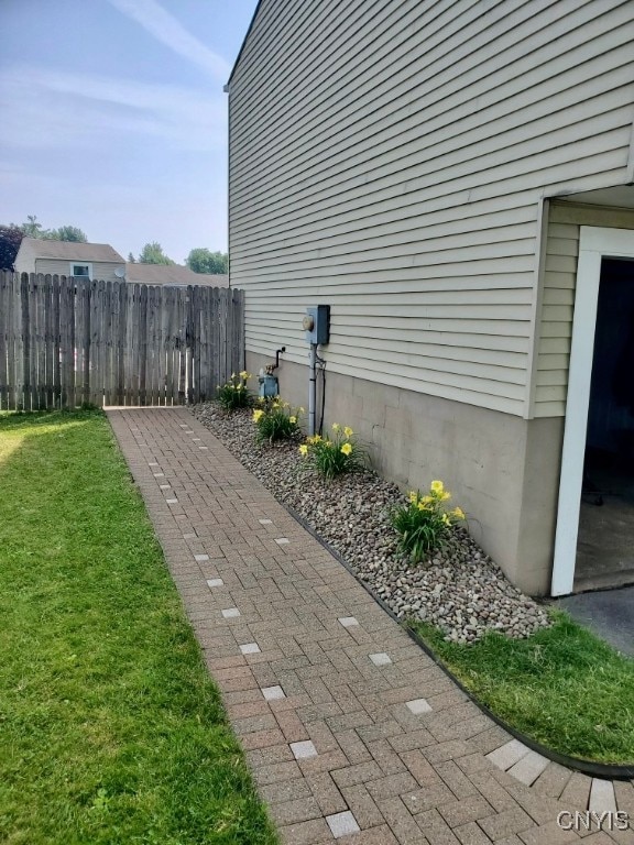 view of side of home featuring a yard