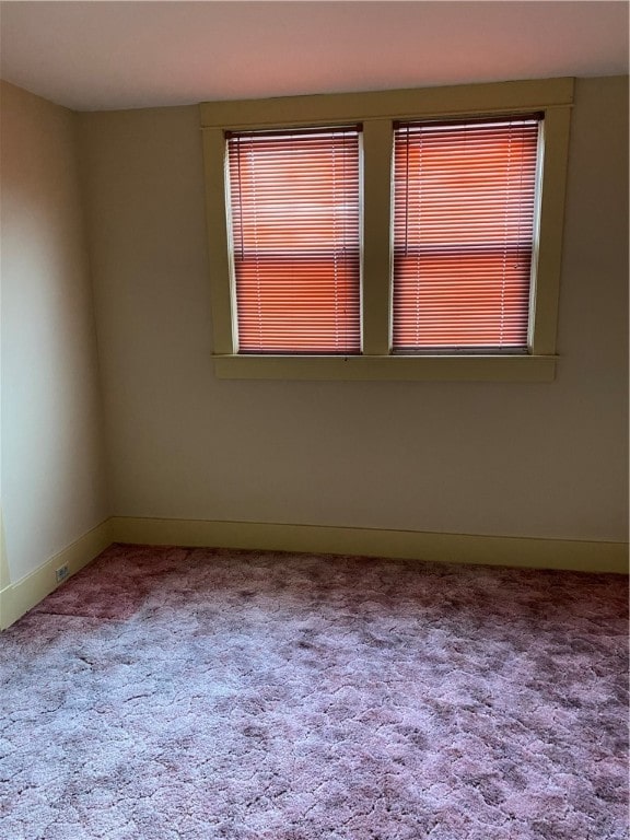 unfurnished room with carpet floors