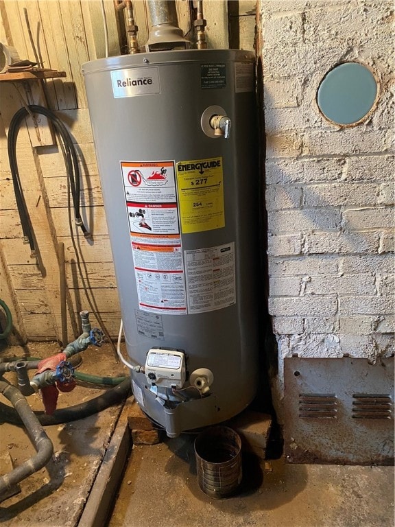 utility room featuring gas water heater