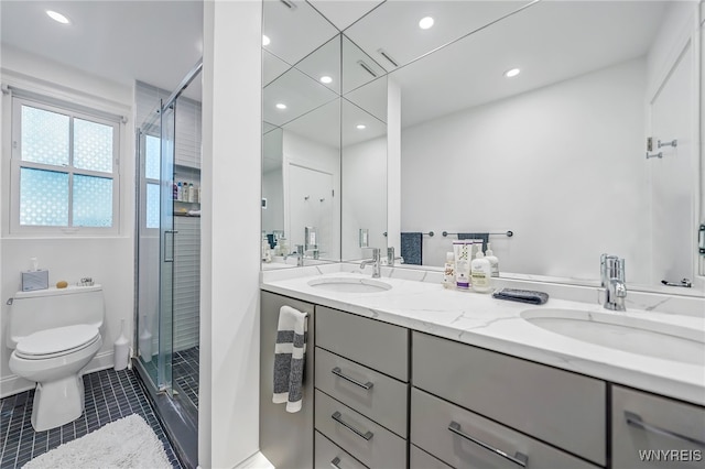 bathroom with walk in shower, tile patterned flooring, vanity, and toilet