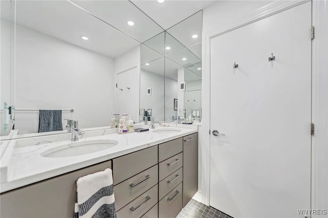 bathroom with tile patterned flooring and vanity