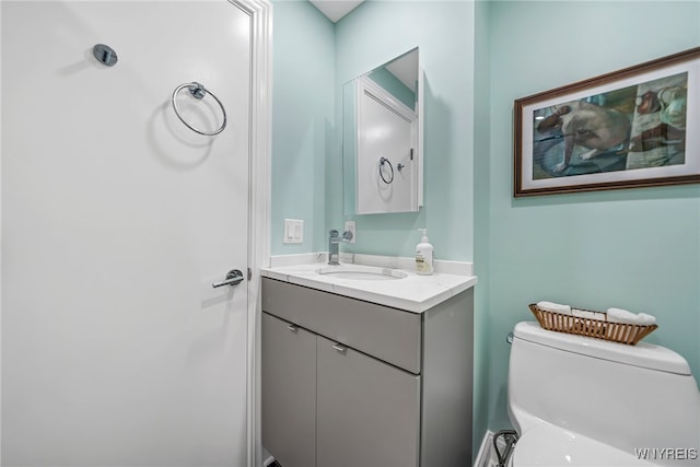 bathroom with vanity and toilet