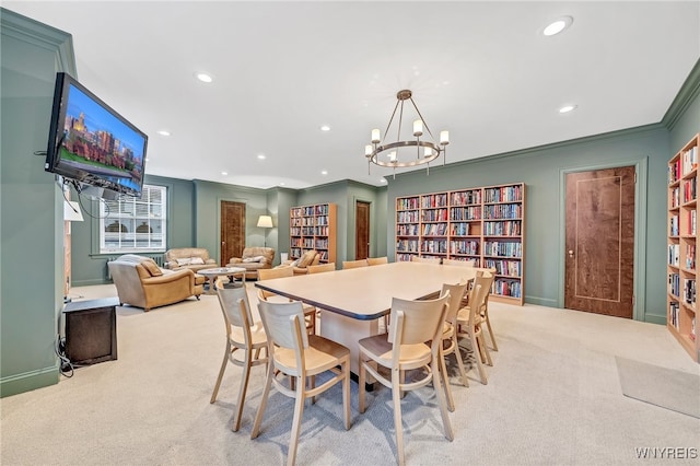 dining space with light colored carpet, crown molding, and a chandelier