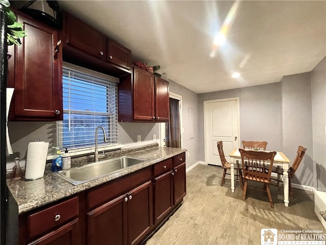 kitchen with light hardwood / wood-style floors and sink