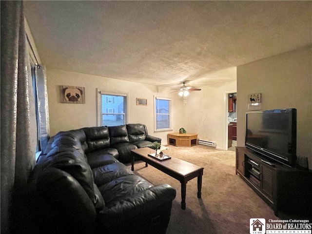 carpeted living room with ceiling fan and a baseboard radiator