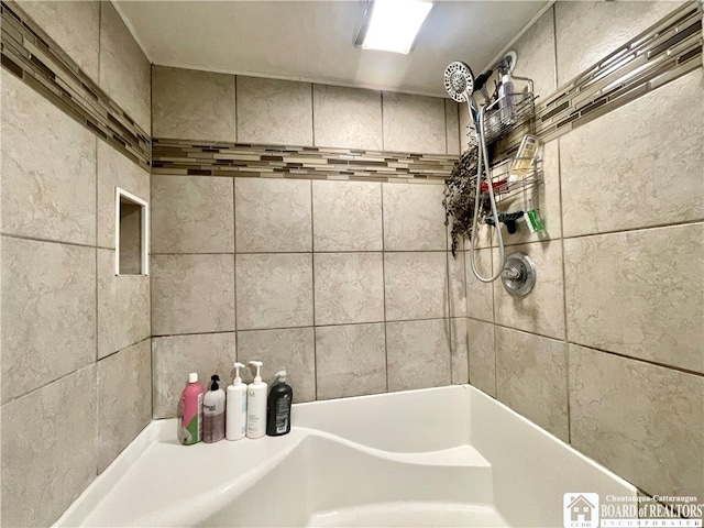 bathroom with a tile shower