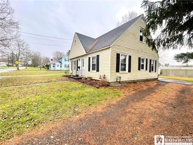 view of side of home featuring a yard