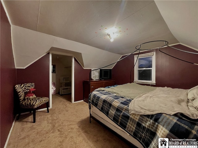 bedroom with light carpet and vaulted ceiling