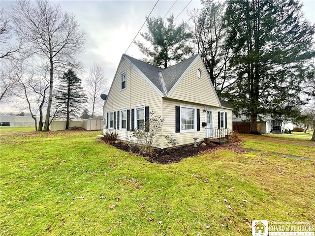 view of property exterior featuring a lawn