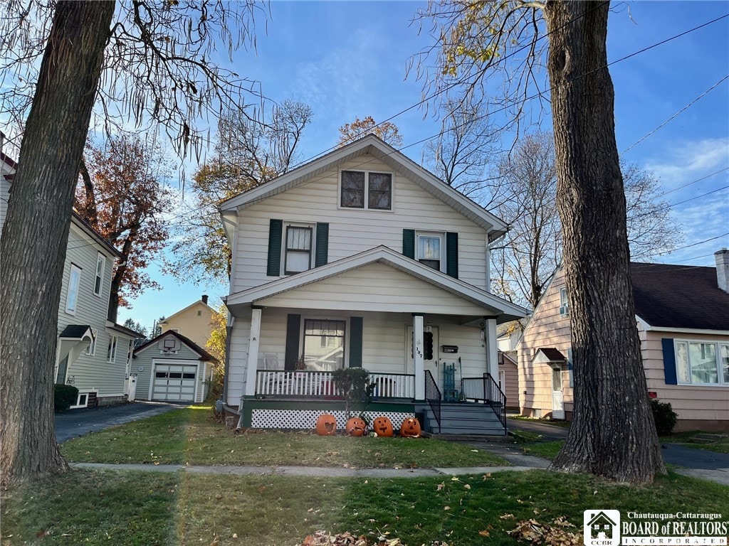 view of front of property with a porch and a front yard