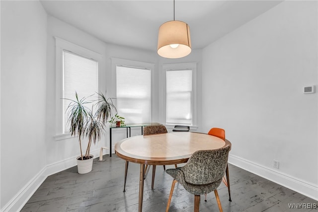 dining room with dark hardwood / wood-style floors