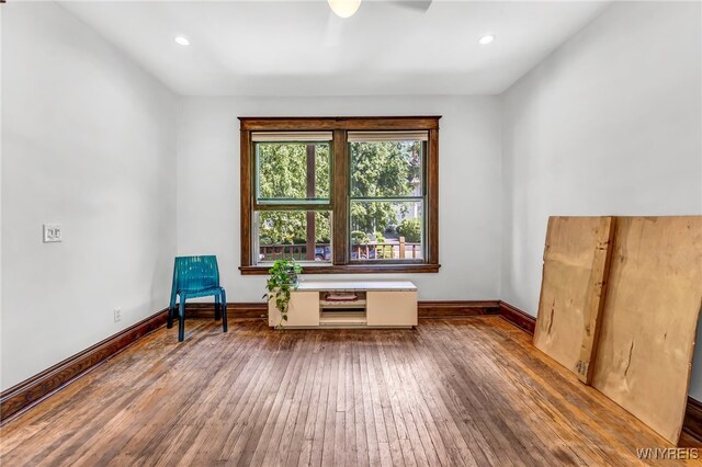 unfurnished room with hardwood / wood-style floors