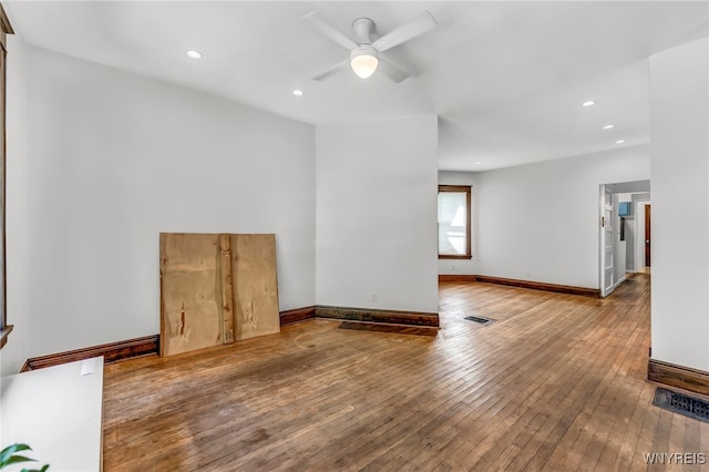 empty room with wood-type flooring and ceiling fan