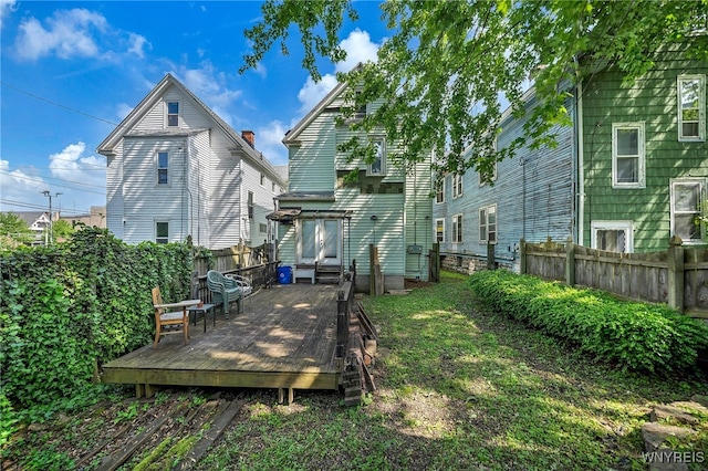 rear view of property with a deck