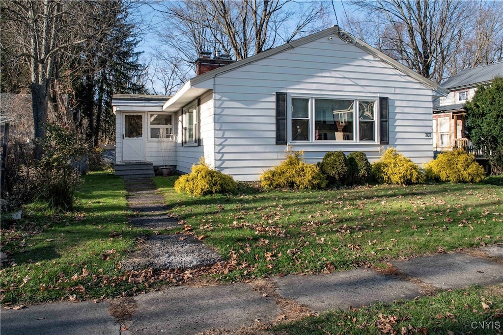 view of property exterior featuring a yard