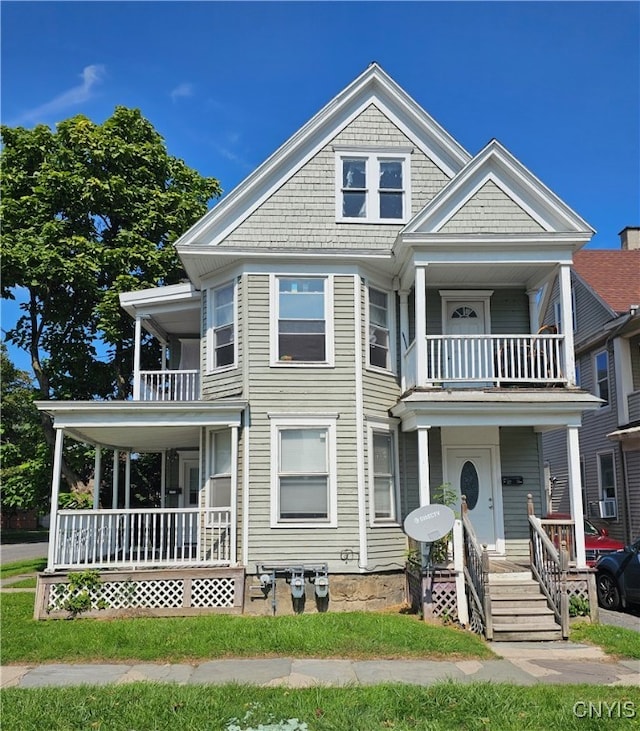 view of front of home with covered porch and a balcony