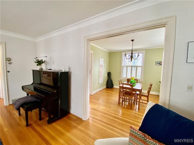 9 Mayfair Ln, Buffalo, NY 14201 - living area featuring a chandelier, light wood-style flooring, crown molding, and baseboards