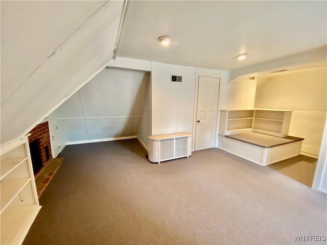 9 Mayfair Ln, Buffalo, NY 14201 - bonus room featuring carpet flooring, a brick fireplace, and vaulted ceiling