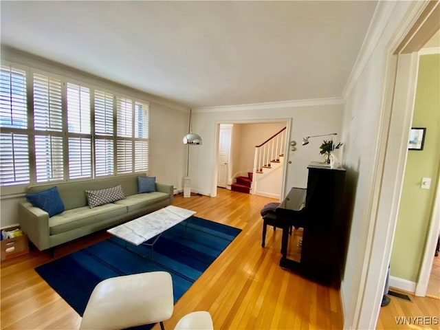 9 Mayfair Ln, Buffalo, NY 14201 - living area featuring ornamental molding, stairs, light wood finished floors, and baseboards