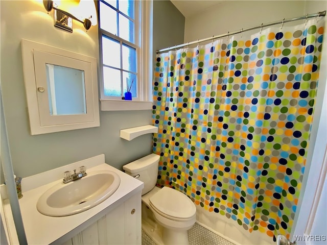 bathroom featuring toilet, vanity, tile patterned floors, and walk in shower