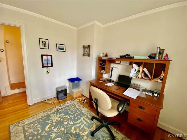 office area with hardwood / wood-style floors and crown molding