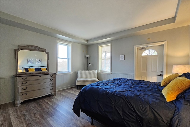 bedroom with dark wood-type flooring