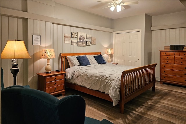 bedroom with ceiling fan, a closet, and wood-type flooring