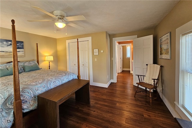 bedroom with a closet, ceiling fan, dark hardwood / wood-style flooring, and a textured ceiling