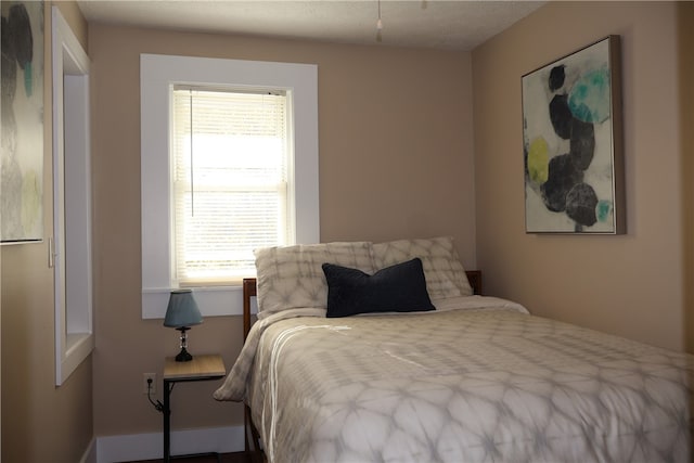 bedroom featuring multiple windows