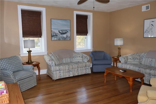 living room featuring ceiling fan and wood-type flooring