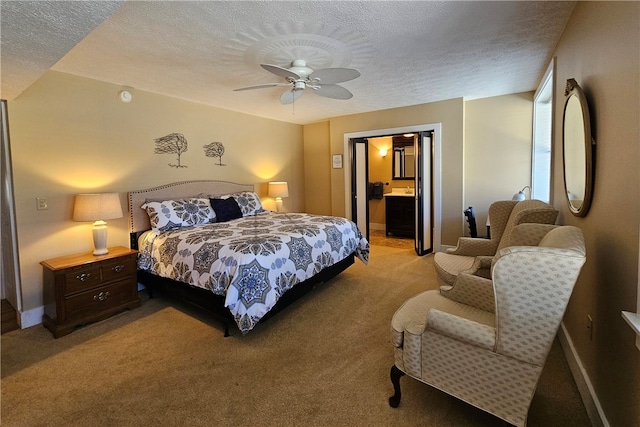 carpeted bedroom featuring ceiling fan, a textured ceiling, and connected bathroom