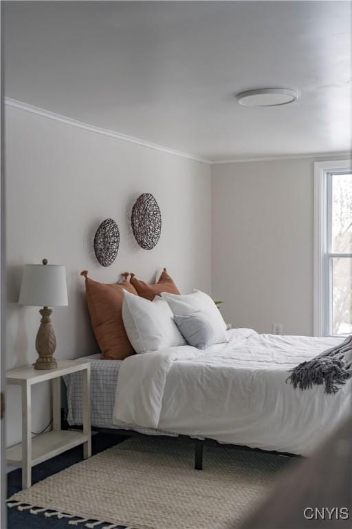 bedroom with ornamental molding