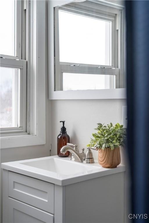 bar with sink and a healthy amount of sunlight