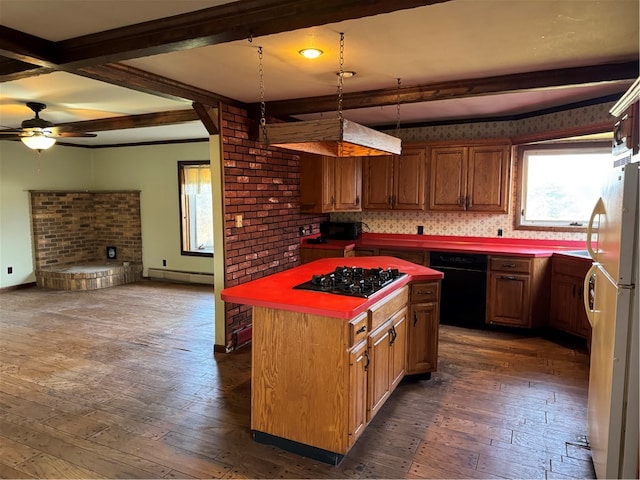 kitchen featuring beamed ceiling, stainless steel gas stovetop, dark hardwood / wood-style flooring, and backsplash