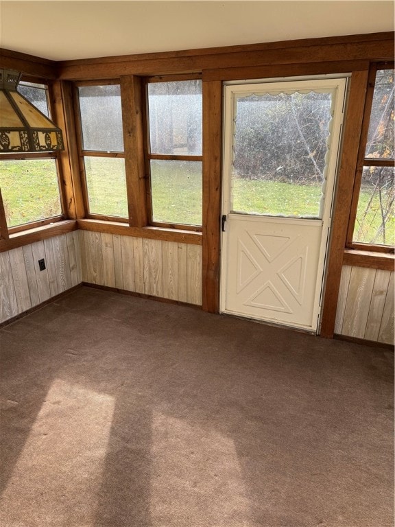 unfurnished sunroom featuring a wealth of natural light