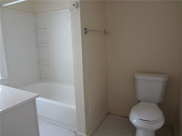 bathroom with tile patterned flooring, vanity, and toilet