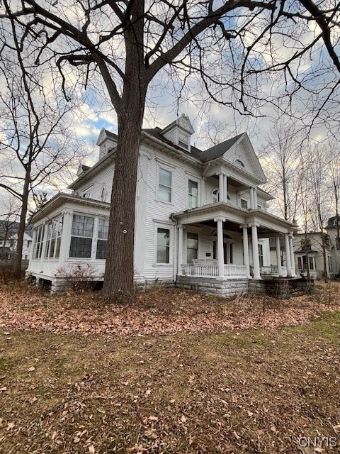 view of home's exterior featuring covered porch