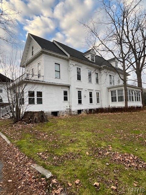 back of house with a yard