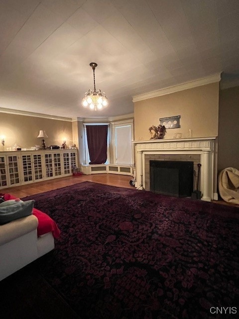 living room with hardwood / wood-style flooring, a notable chandelier, and ornamental molding