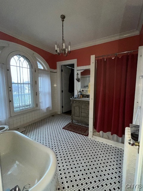 bathroom featuring radiator heating unit, tile patterned flooring, and a washtub